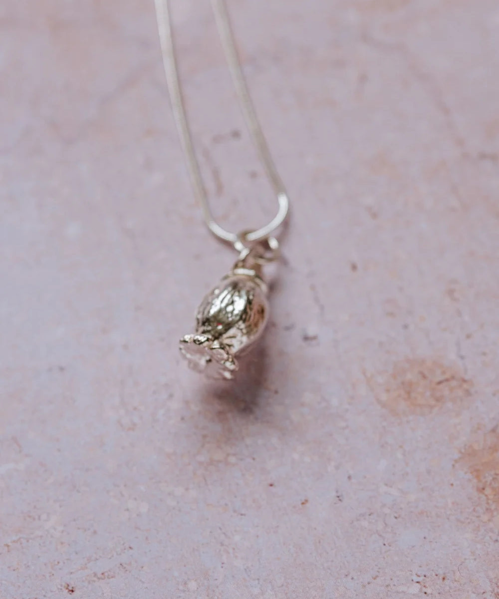 Handmade fine silver poppy seedhead pendant with wrap-around bail on sterling silver snake chain