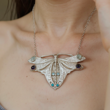 Luna moth statement silver necklace with gemstones shown on model, unique handmade silver jewellery UK
