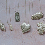 Group of fine silver leaf pendant necklaces on chains, recycled silver jewellery inspired by nature, handmade in the UK

