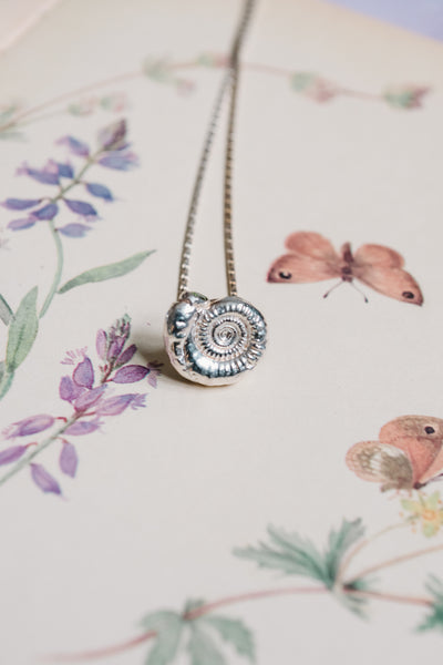 Silver Ammonite Fossil Necklace with Green CZ