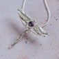 Handcrafted silver dragonfly pendant necklace with faceted amethyst gemstone, unique handmade silver jewellery inspired by nature.
