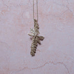 Close-up of handmade silver dragonfly and catkin pendant on sterling chain, artisan botanical jewellery necklace, symbolic nature jewellery gift for her