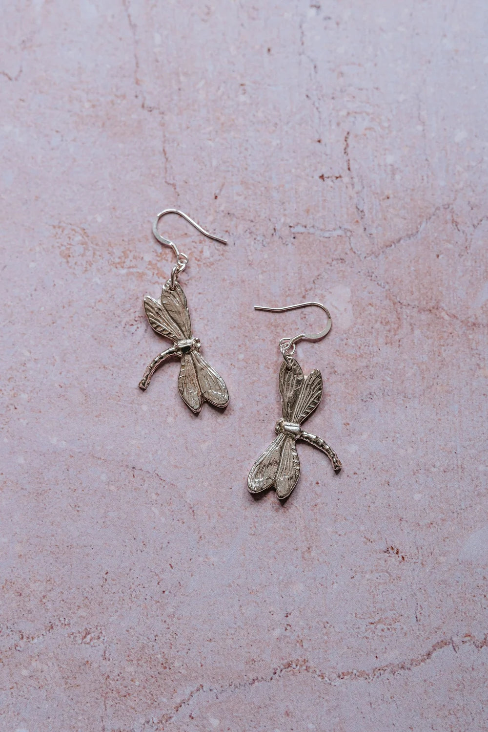 Handcrafted silver dragonfly dangle earrings, artisan nature-inspired jewellery made in the UK.